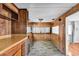 This is the living area of a mobile home, with wood paneling and new floors at 6001-N74 South Kings Hwy., Myrtle Beach, SC 29575