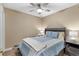 Comfortable bedroom with ceiling fan, bedside lamps, and a wooden headboard at 625 N Waccamaw Dr. # 107, Murrells Inlet, SC 29576