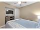Bedroom with TV in the closet, ceiling fan, and natural light at 625 N Waccamaw Dr. # 107, Murrells Inlet, SC 29576