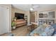 Open-concept living room flowing into the kitchen with bar seating at 625 N Waccamaw Dr. # 107, Murrells Inlet, SC 29576