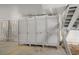 Outdoor storage area with numbered closet spaces and a staircase at 625 N Waccamaw Dr. # 107, Murrells Inlet, SC 29576