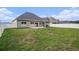 View of the backyard and patio, complete with a well-manicured lawn and fence at 630 Heartwood Dr., Conway, SC 29526