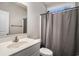 Bathroom featuring a single sink vanity, a toilet, and a shower with a gray curtain at 630 Heartwood Dr., Conway, SC 29526