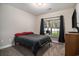 Bedroom featuring a neutral color scheme, carpet, and a window overlooking the backyard at 630 Heartwood Dr., Conway, SC 29526