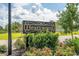 Attractive Heartwood community sign surrounded by lush landscaping and flowering bushes at 630 Heartwood Dr., Conway, SC 29526
