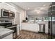 Modern kitchen with stainless steel appliances, granite countertops, and white cabinets at 630 Heartwood Dr., Conway, SC 29526