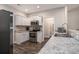 Contemporary kitchen featuring stainless steel appliances, granite countertops, and white cabinets at 630 Heartwood Dr., Conway, SC 29526