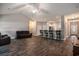 Open concept living room with a vaulted ceiling, hardwood floors, and bar seating at 630 Heartwood Dr., Conway, SC 29526