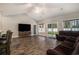 Spacious living room featuring vaulted ceilings, hardwood floors, and natural light at 630 Heartwood Dr., Conway, SC 29526