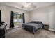 Serene main bedroom with soft carpet, a ceiling fan, and a bright window view at 630 Heartwood Dr., Conway, SC 29526