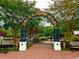 Scenic River Walk entrance with brick pathway, lush greenery, and convenient access to parking at 630 Heartwood Dr., Conway, SC 29526