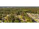 Aerial view showcasing a peaceful neighborhood surrounded by lush greenery at 645 Boundary Line Dr. Nw, Calabash, NC 28467