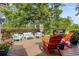 Spacious wooden deck with seating, a grill, and a view of the landscaped backyard at 645 Boundary Line Dr. Nw, Calabash, NC 28467
