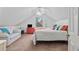 This bedroom features a vaulted ceiling, light carpeting, and bright accents at 645 Boundary Line Dr. Nw, Calabash, NC 28467