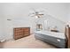 Bedroom with a king size bed, dresser, and ceiling fan and walk-in closet at 645 Boundary Line Dr. Nw, Calabash, NC 28467