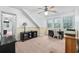 Bedroom featuring a ceiling fan, an office desk, and natural light from windows at 645 Boundary Line Dr. Nw, Calabash, NC 28467
