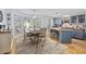 Charming kitchen with a dining area featuring blue cabinets, butcher block countertops and large windows at 645 Boundary Line Dr. Nw, Calabash, NC 28467