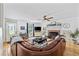Cozy living room with a brick fireplace, hardwood floors, and comfortable seating at 645 Boundary Line Dr. Nw, Calabash, NC 28467