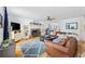 Bright living room with a fireplace, hardwood floors, comfortable seating and natural light at 645 Boundary Line Dr. Nw, Calabash, NC 28467