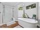 Bright and airy main bathroom with walk-in shower and stand alone tub at 645 Boundary Line Dr. Nw, Calabash, NC 28467