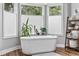 Charming main bathroom featuring a stand alone tub and natural light at 645 Boundary Line Dr. Nw, Calabash, NC 28467