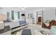 Spacious main bedroom features neutral carpeting, white walls, a comfortable seating area, and access to the main bathroom at 645 Boundary Line Dr. Nw, Calabash, NC 28467