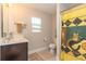Neutral bathroom featuring a vanity, toilet, shower/tub combination and unique shower curtain at 672 Ashley Manor Dr., Longs, SC 29568