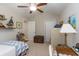Bedroom with vaulted ceilings featuring a ceiling fan, desk and art at 672 Ashley Manor Dr., Longs, SC 29568