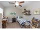 Bright bedroom featuring a single bed, desk and stylish coastal decor at 672 Ashley Manor Dr., Longs, SC 29568
