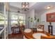 Cozy dining area with warm lighting and a view to the entry at 672 Ashley Manor Dr., Longs, SC 29568