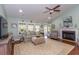 Bright living room features a fireplace, comfortable seating, and access to the outdoors at 672 Ashley Manor Dr., Longs, SC 29568