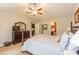 Main bedroom with a four-poster bed, and an ensuite bathroom with modern fixtures at 672 Ashley Manor Dr., Longs, SC 29568
