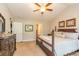 Serene main bedroom with vaulted ceilings, a plush bed, and a well-appointed ensuite at 672 Ashley Manor Dr., Longs, SC 29568