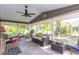 Relaxing screened porch with stylish furniture and a view of the backyard at 672 Ashley Manor Dr., Longs, SC 29568