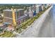 A high-angle view shows the beachside condo, oceanfront views, and a sandy beach at 6900 N Ocean Blvd. # 1437, Myrtle Beach, SC 29572