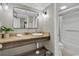 The bathroom features a granite vanity, a framed mirror, and a shower-tub combination at 6900 N Ocean Blvd. # 1437, Myrtle Beach, SC 29572
