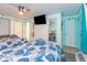 Charming bedroom with two beds, flat-screen TV, and ample natural light at 6900 N Ocean Blvd. # 710, Myrtle Beach, SC 29572
