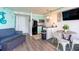 Open-concept living space includes a kitchen, dining area, and comfortable seating at 6900 N Ocean Blvd. # 710, Myrtle Beach, SC 29572