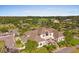 An aerial view of a large, modern home on a golf course at 79 Windsor Circle Sw, Ocean Isle Beach, NC 28469