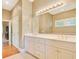Bright bathroom with double sinks and a large mirror above the vanity at 79 Windsor Circle Sw, Ocean Isle Beach, NC 28469