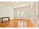 Bright, airy room featuring hardwood floors, a large window, and elegant white trim, creating a welcoming space at 79 Windsor Circle Sw, Ocean Isle Beach, NC 28469