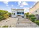 Exterior view of a multi-story home with a spacious deck and beach access at 80 Landing Dr. # 80, Pawleys Island, SC 29585