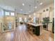 Open-concept living area with a spacious kitchen island, pendant lights, and stainless steel appliances at 80 Landing Dr. # 80, Pawleys Island, SC 29585