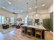 Modern kitchen featuring a large island with seating, stainless steel appliances, and an open layout to the living area at 80 Landing Dr. # 80, Pawleys Island, SC 29585