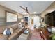 Comfortable living room featuring a brown leather sofa, a stylish rug, and a view of the bar area at 80 Landing Dr. # 80, Pawleys Island, SC 29585