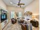 Cozy living room featuring a plush sofa, leather armchairs, and a decorative wall display at 80 Landing Dr. # 80, Pawleys Island, SC 29585