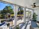 Charming porch featuring a comfortable seating area, views of the backyard, and an outdoor fireplace at 80 Landing Dr. # 80, Pawleys Island, SC 29585