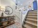 Elegant interior stairway with stylish decor, a round mirror, and modern railings at 80 Landing Dr. # 80, Pawleys Island, SC 29585
