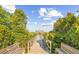 Picturesque walkway leading to a gazebo amidst lush greenery with bench seating at 80 Landing Dr. # 80, Pawleys Island, SC 29585
