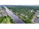 Stunning aerial view of waterfront homes along a serene river with a golf course and lush green surroundings at 931 Cedarwood Circle, Myrtle Beach, SC 29572